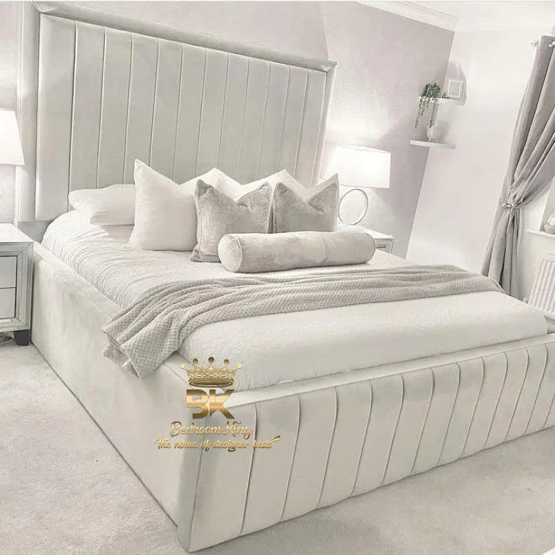 Cosy bedroom styled with a high-sided upholstered bed frame