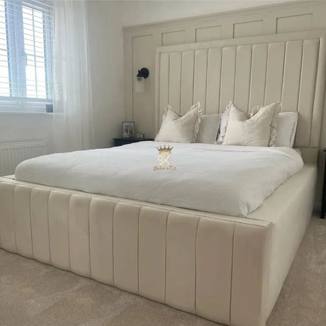 Jade upholstered bed frame with high side panels in a modern bedroom
