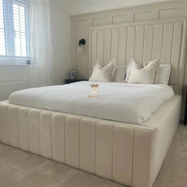 Jade upholstered bed frame with high side panels in a modern bedroom